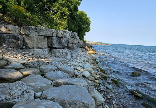 Shell Park shoreline rehabilitation and stabilization project site prior to construction, including the existing armourstone wall along the shoreline.