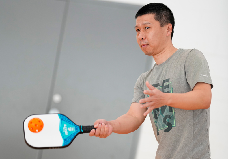 Person playing pickleball