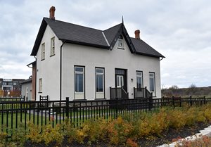 Built in 1866 in the Gothic Revival style, the house at 3041 Post Street has a symmetrical front façade with a central front door and four unique full-length casement windows with transom windows. 