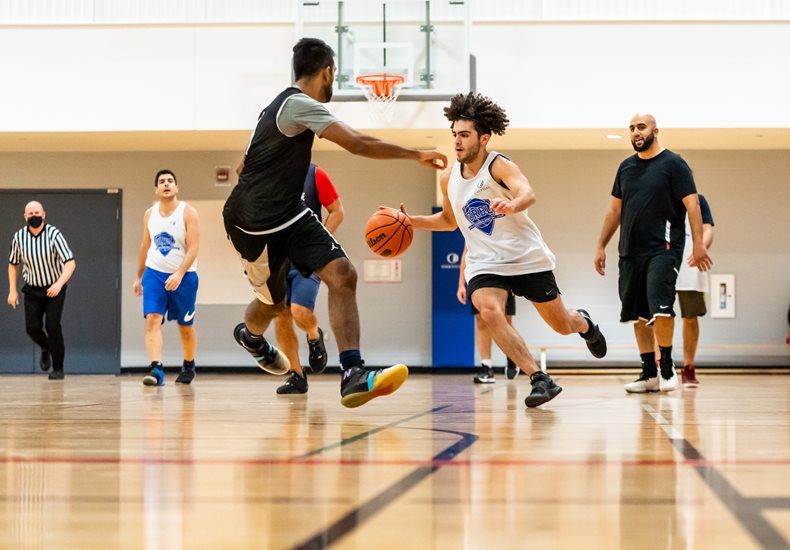 Basketball players running on the court