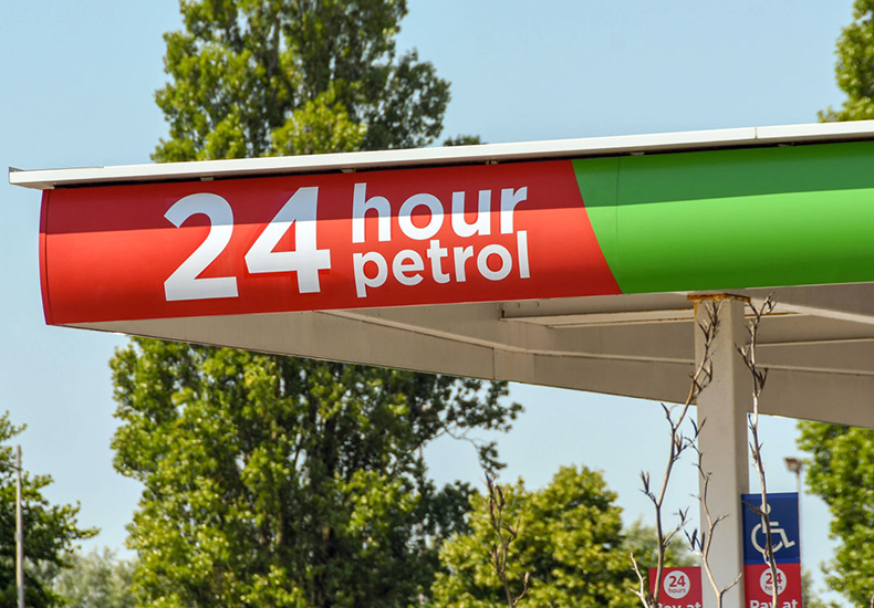 Example of a permanent canopy fuel pump sign.