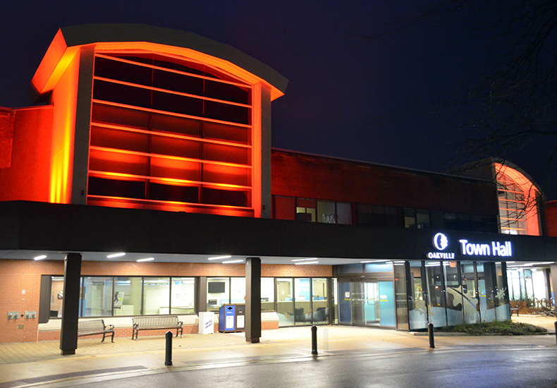 Oakville Town Hall is lit by orange lights for National Day of Truth and Reconciliation and Orange Shirt Day